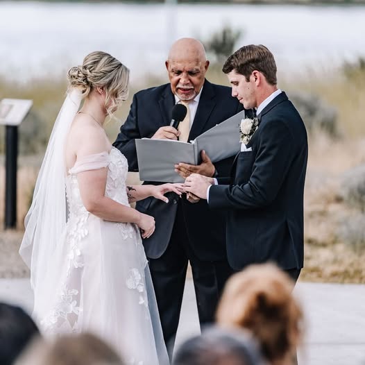 Reverend Arthur leading a couple through their wedding ceremony
